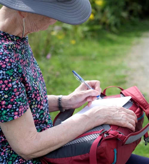 Judith Morris making notes for her memoir Stepping out of Silence